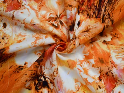 Cotton voile fabric with large orange hibiscus print