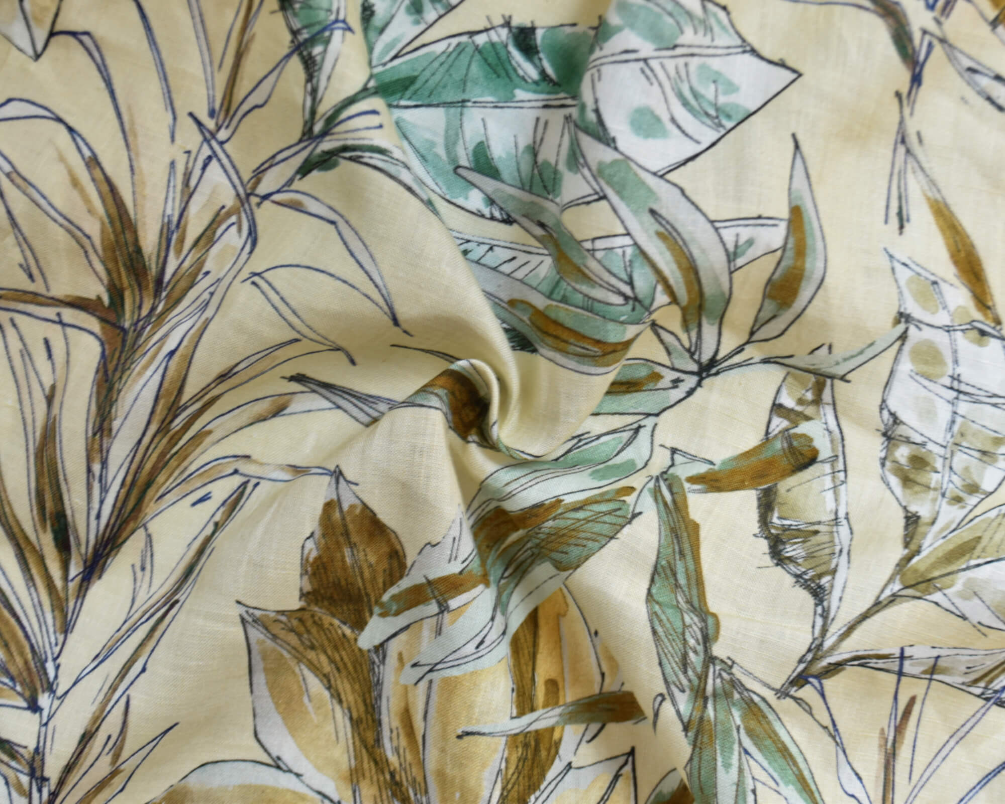 Palm frond print on yellow background midweight linen fabric